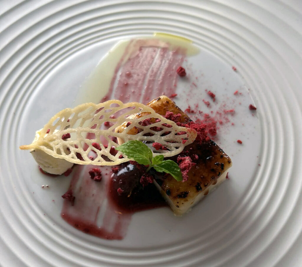 A photo of a Plantain Tartlet with pickled chili peppers